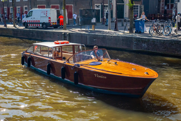 a boat is docked next to a body of water